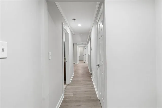 a kitchen with stainless steel appliances granite countertop a refrigerator and a stove