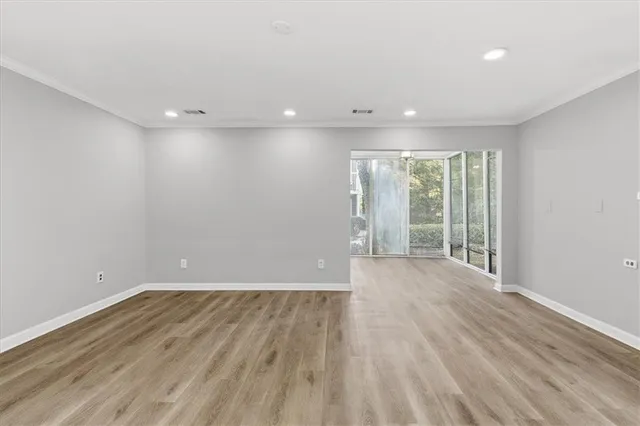 a view of a livingroom with wooden floor