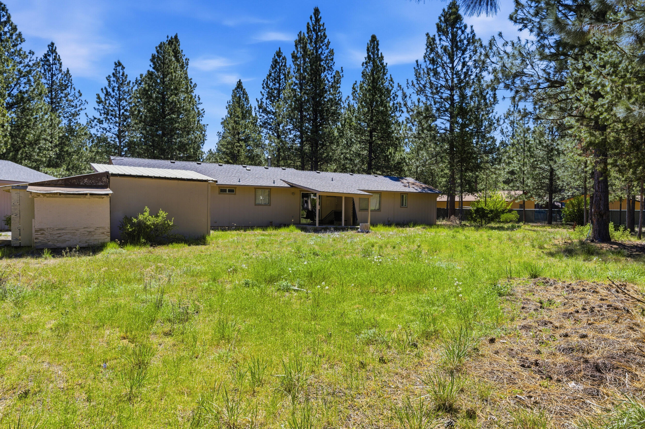 50868 Doe Loop La Pine, OR 97739 - Photo 43 of 51 a view of a house with backyard and a sitting area