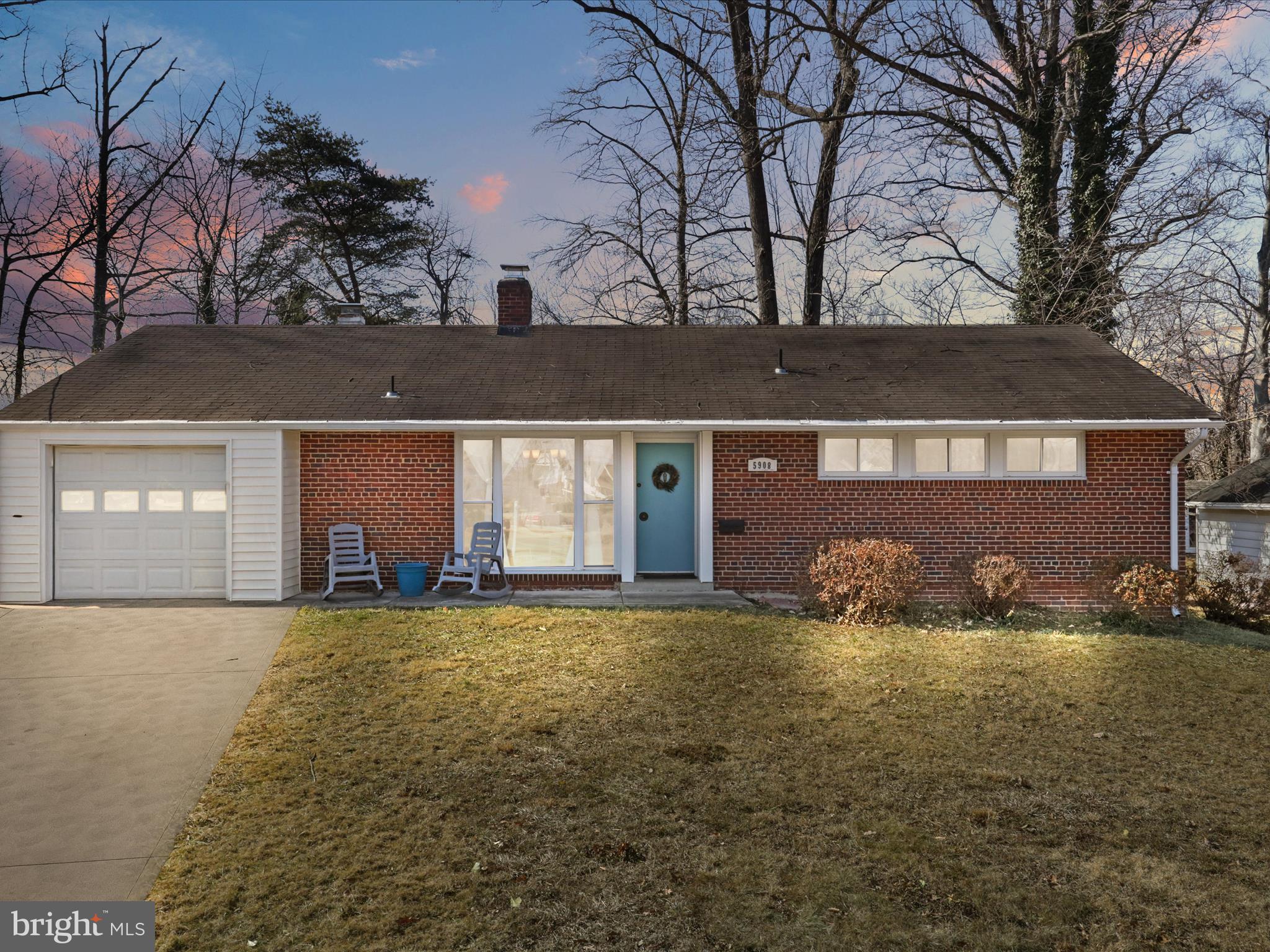 5908 Hanover Avenue Springfield, VA 22150 - Photo 1 of 32 a front view of a house with yard and trees in the background