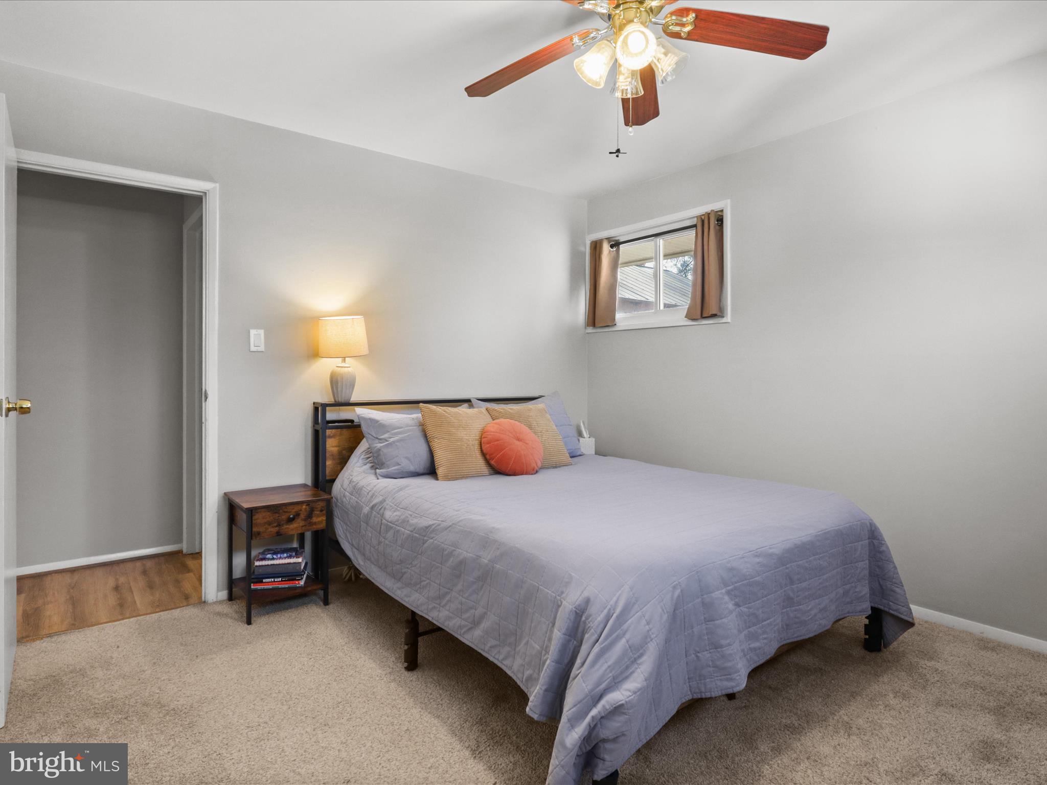 5908 Hanover Avenue Springfield, VA 22150 - Photo 20 of 32 a bedroom with a bed and a chandelier