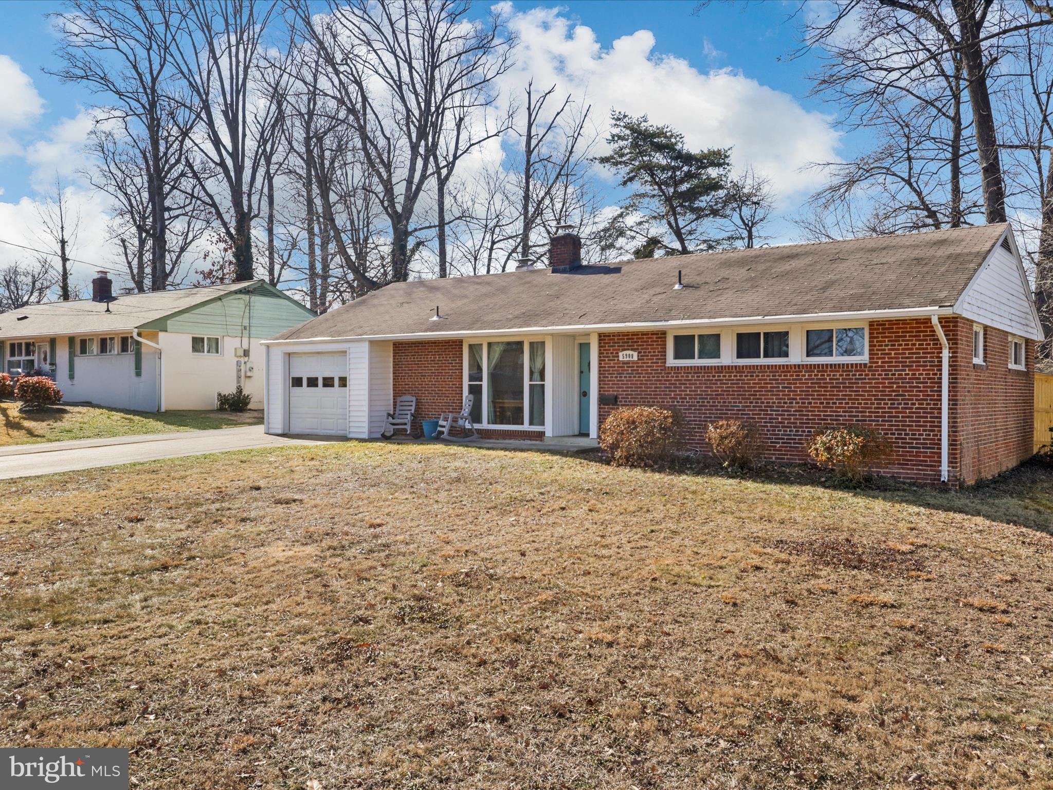 5908 Hanover Avenue Springfield, VA 22150 - Photo 31 of 32 a front view of a house with a garden