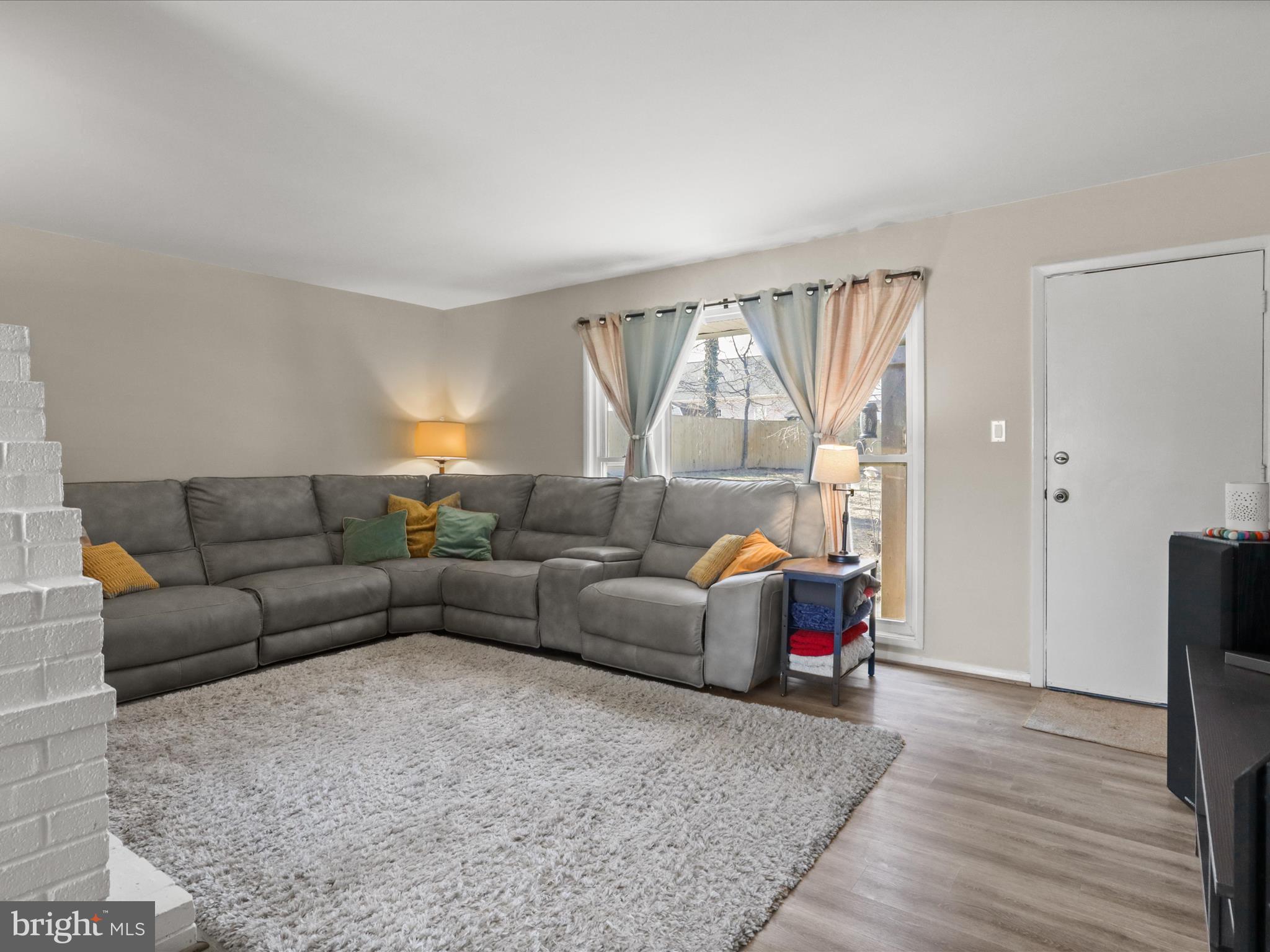 5908 Hanover Avenue Springfield, VA 22150 - Photo 4 of 32 a living room with furniture and a large window