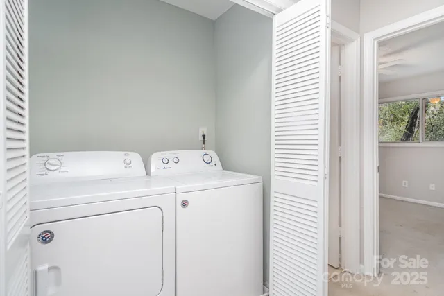 a view of a house with a tree in front of it