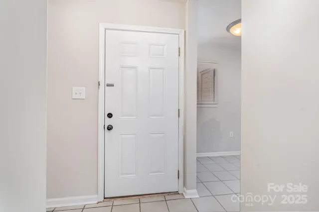 a view of an empty room with a fireplace