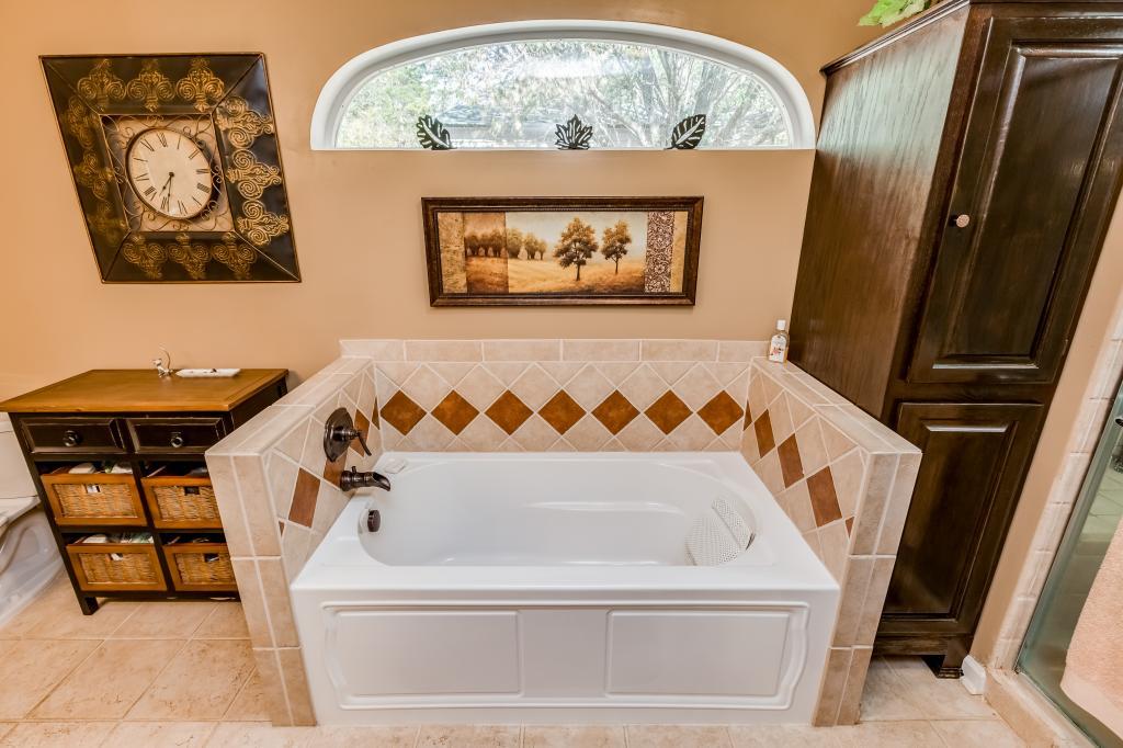 661 Beckwith Road Mount Juliet, TN 37122 - Photo 12 of 26 a bathroom with a bathtub and a window