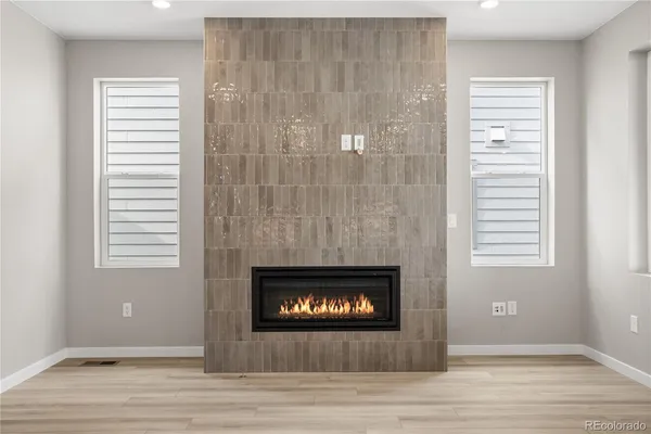 a living room with a fireplace and a floor