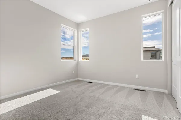 an empty room with windows