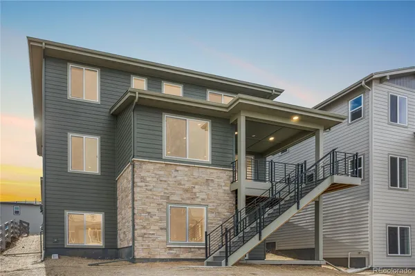 a front view of a house with stairs