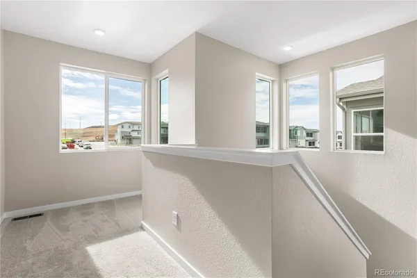 a living room with large windows