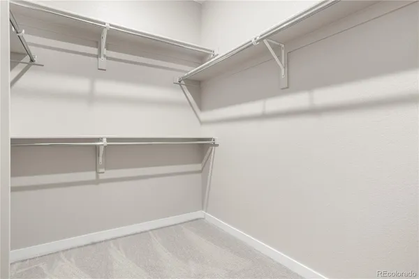 a view of an empty walk in closet