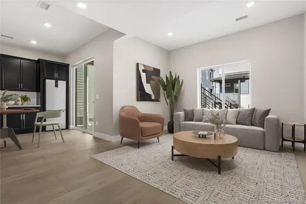 a living room with furniture and a table