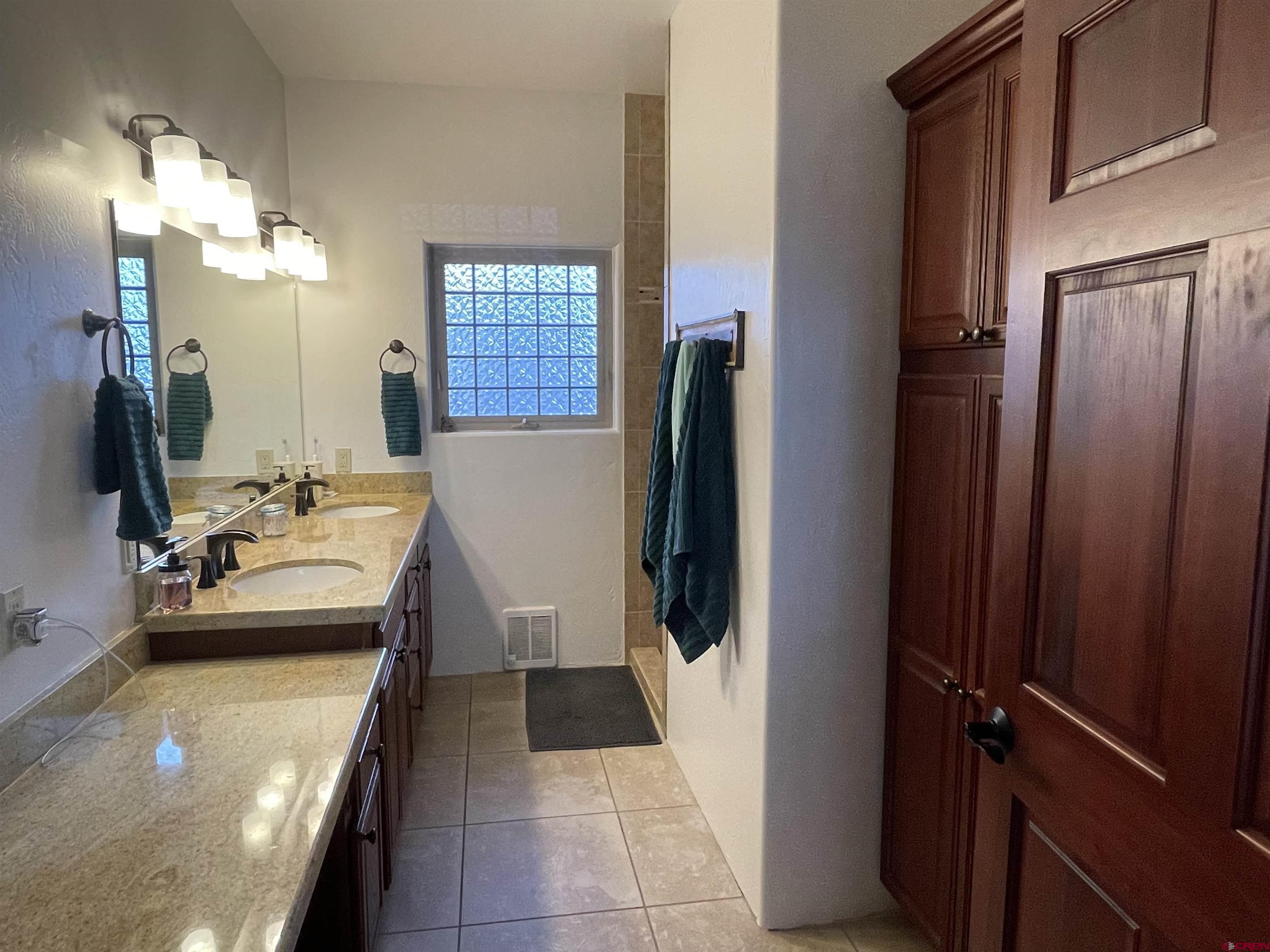 2271 Par Drive Cortez, CO 81321 - Photo 20 of 36 a bathroom with a sink a toilet and shower