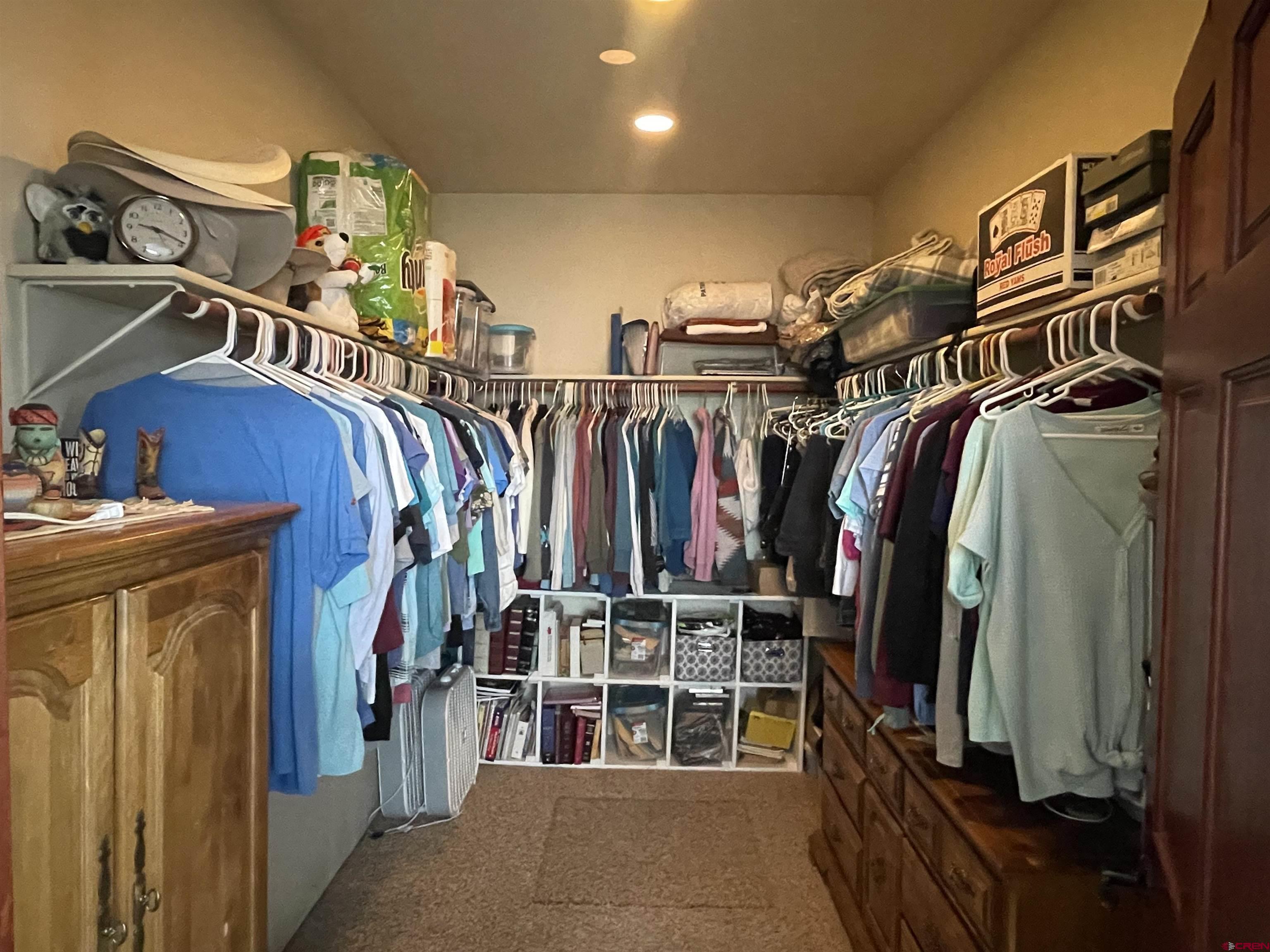 2271 Par Drive Cortez, CO 81321 - Photo 21 of 36 a view of walk in closet with clothes and shoes
