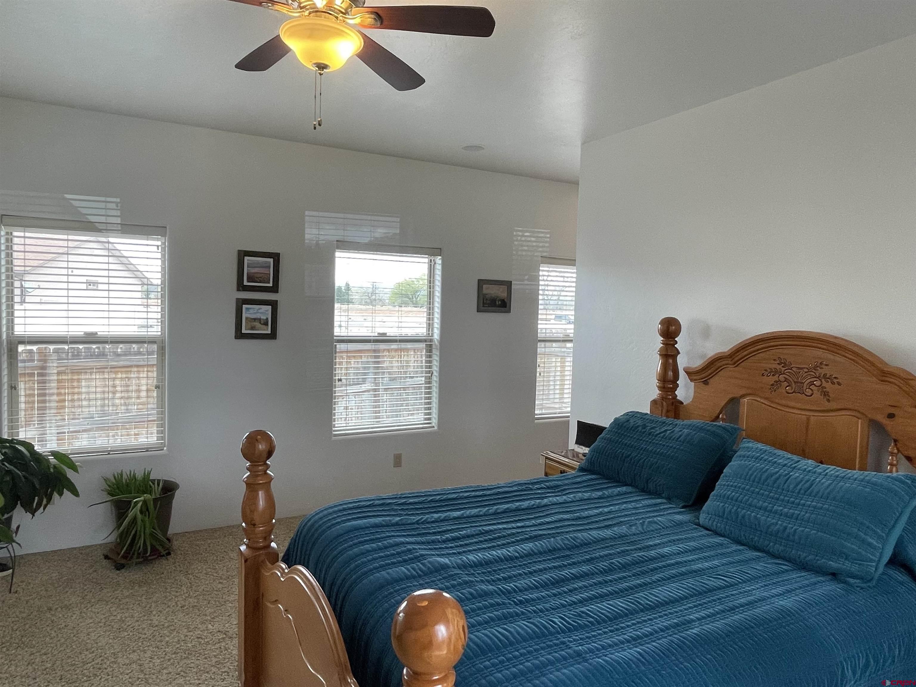 2271 Par Drive Cortez, CO 81321 - Photo 25 of 36 a bed sitting in a bedroom next to a window