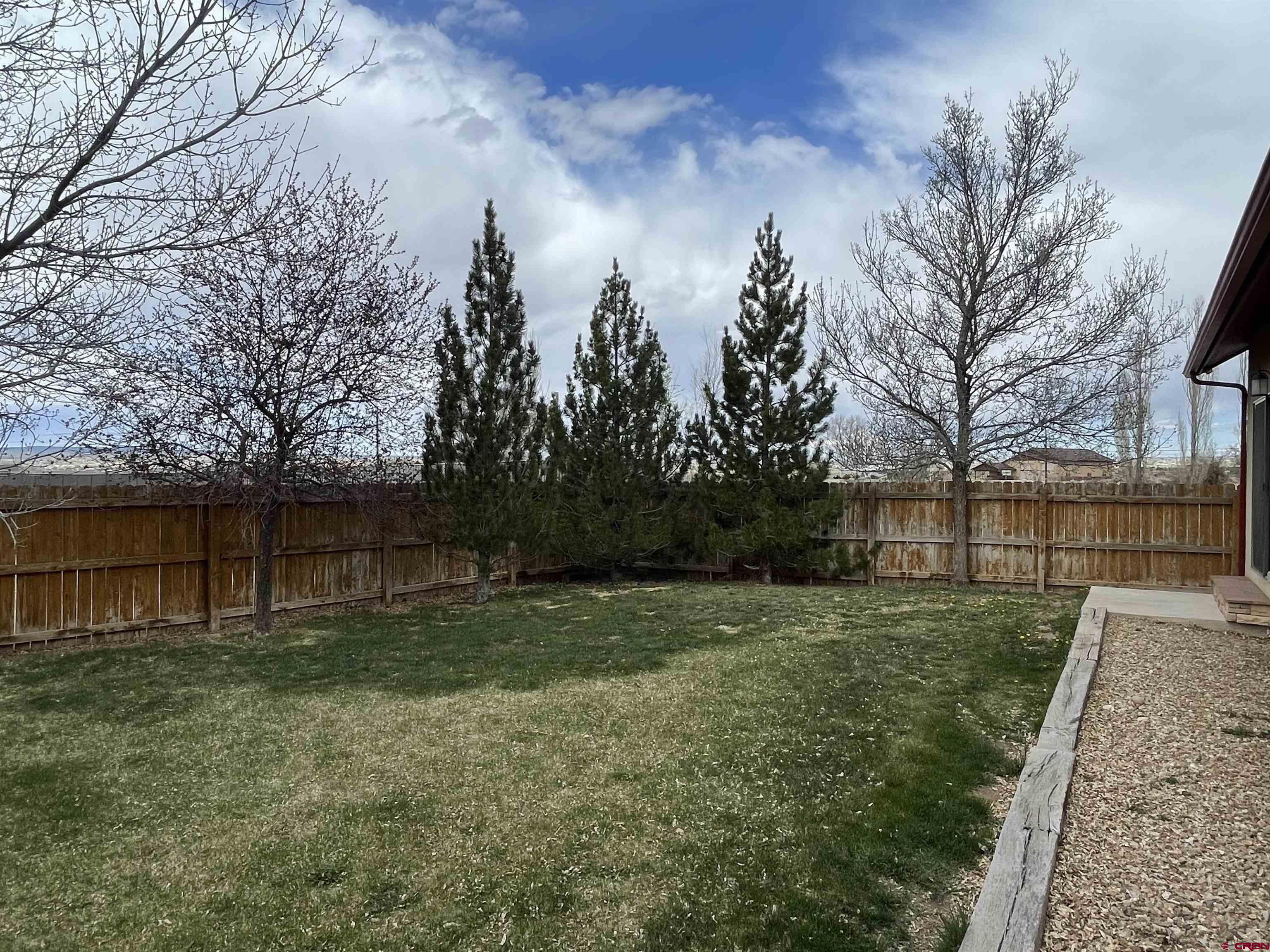 2271 Par Drive Cortez, CO 81321 - Photo 27 of 36 a backyard of a house with lots of green space