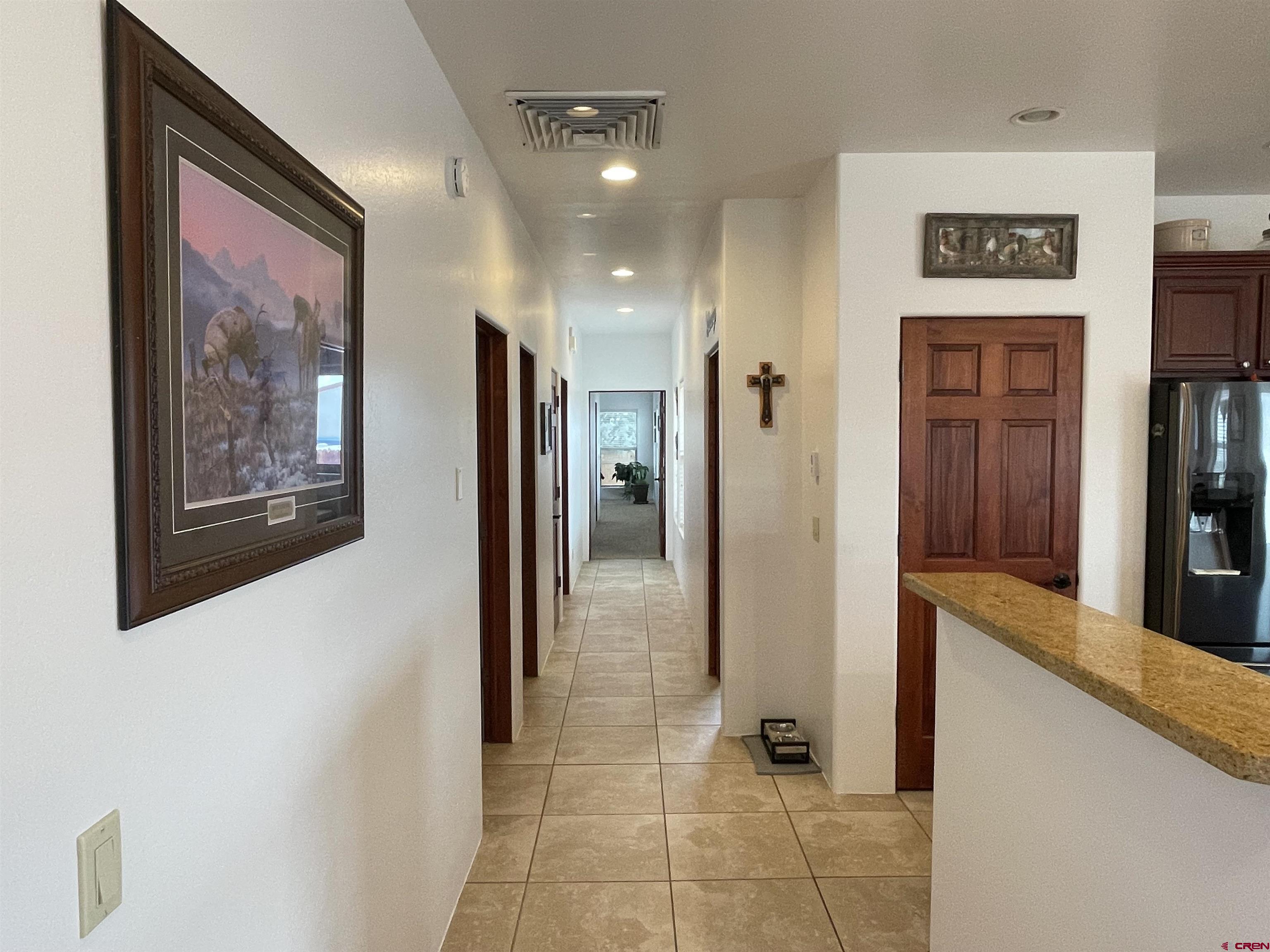 2271 Par Drive Cortez, CO 81321 - Photo 9 of 36 a view of a hallway with wooden floor