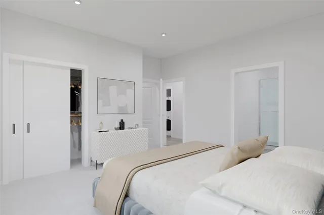 a bedroom with two beds and white walls