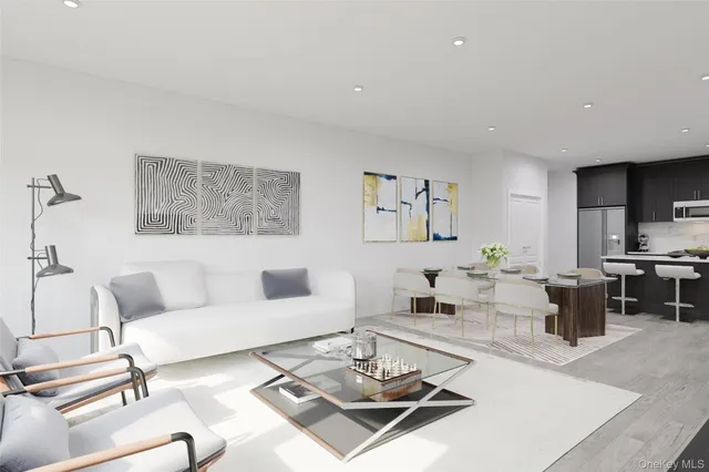 a living room with furniture a rug and a table