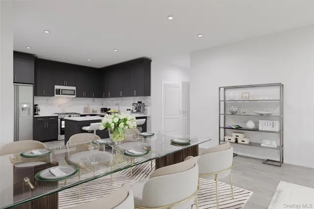 a kitchen with stainless steel appliances kitchen island granite countertop a sink and cabinets