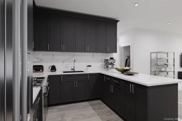 a kitchen with a sink a stove and cabinets