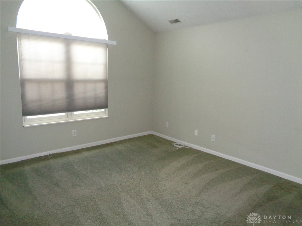 80 Villa Pointe Drive Springboro, OH 45066 - Photo 11 of 19 This spacious room features vaulted ceilings, arched window and soft carpeting, creating a bright and airy atmosphere.