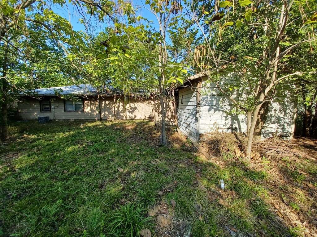 617 Grayson Street Pottsboro, TX 75076 - Photo 2 of 6 a backyard of a house with lots of green space