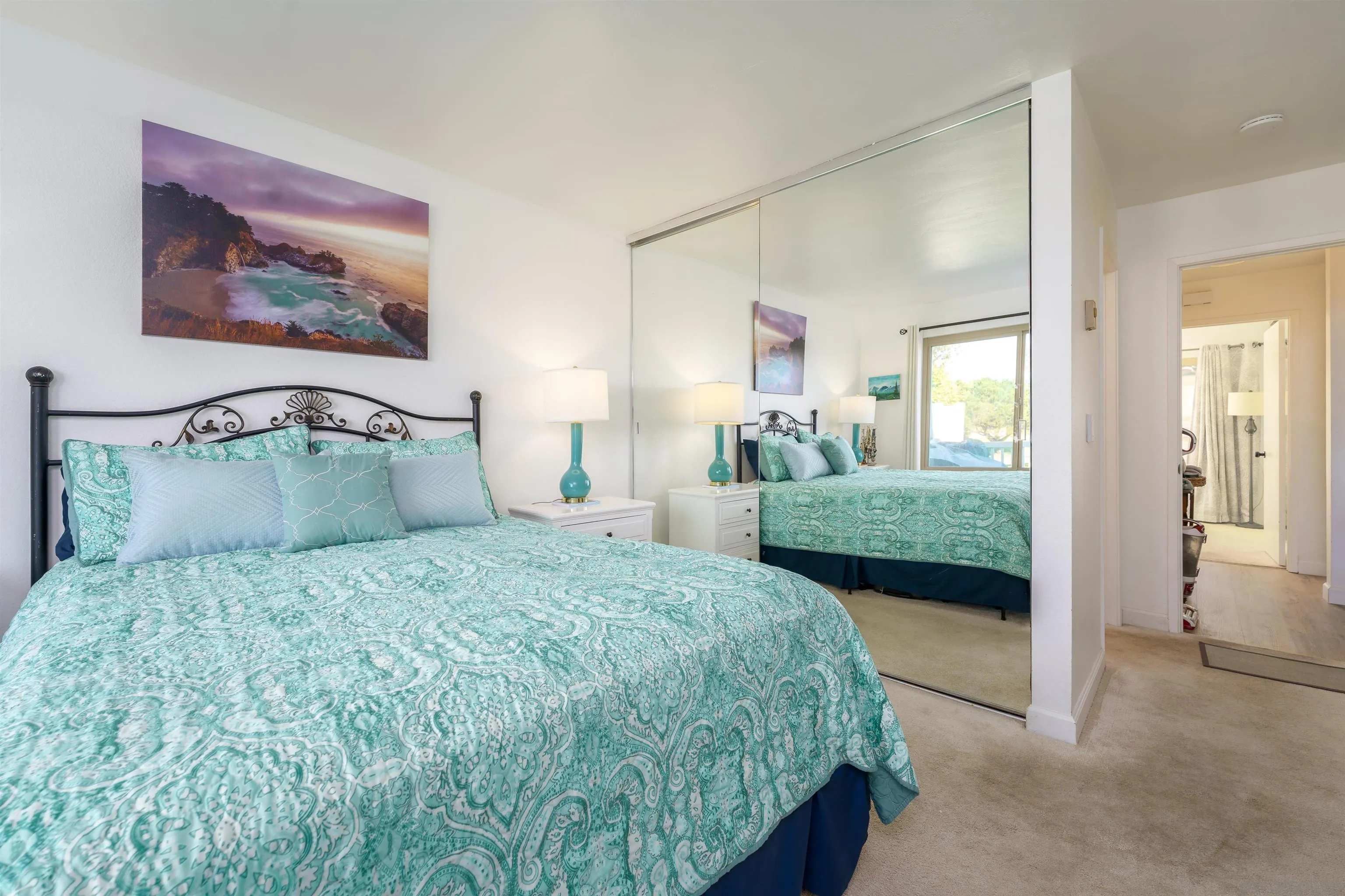 346 Abington Road Encinitas, CA 92024 - Photo 13 of 33 a bedroom with a bed and glass windows