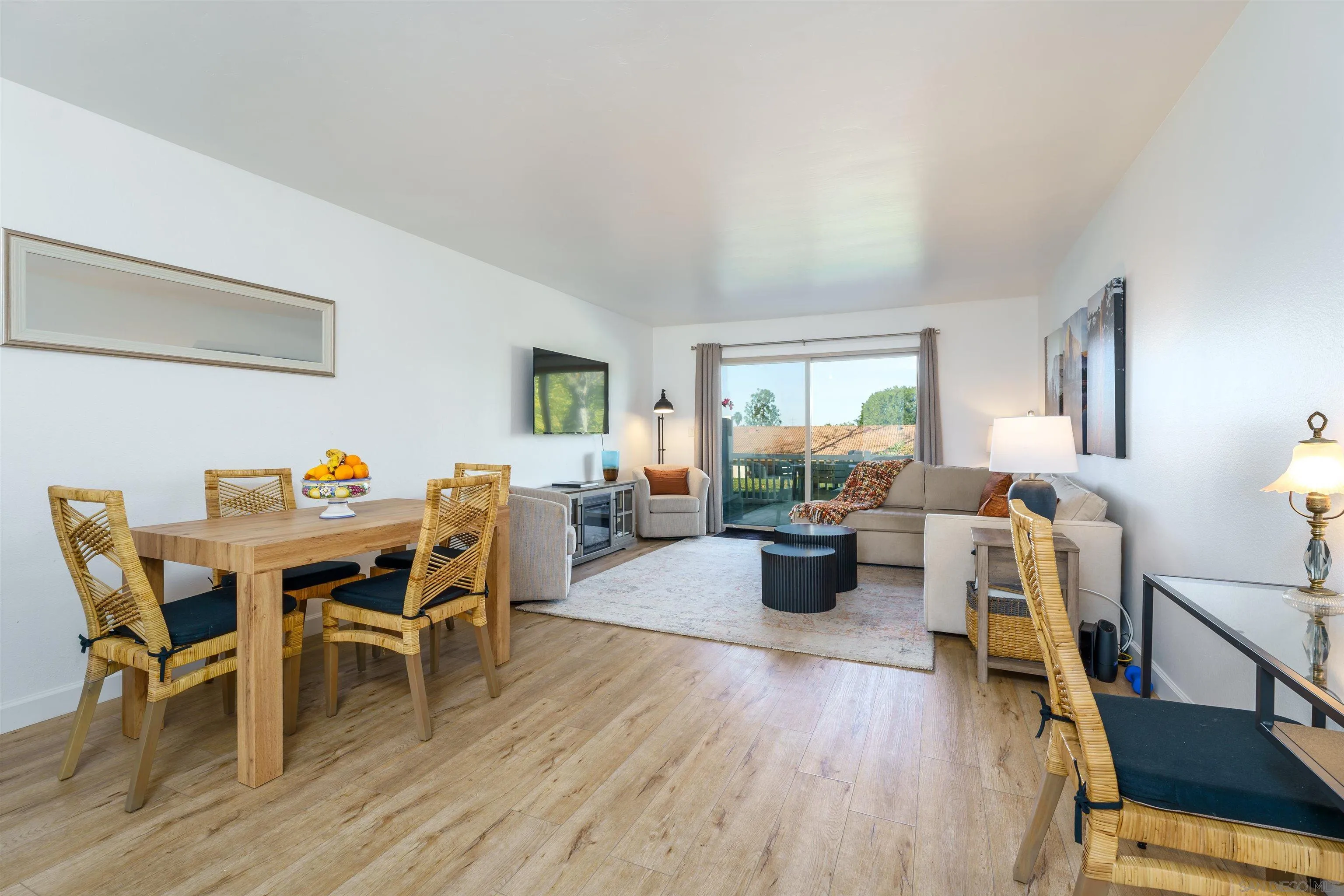 346 Abington Road Encinitas, CA 92024 - Photo 14 of 33 a view of a dining room with furniture window and wooden floor