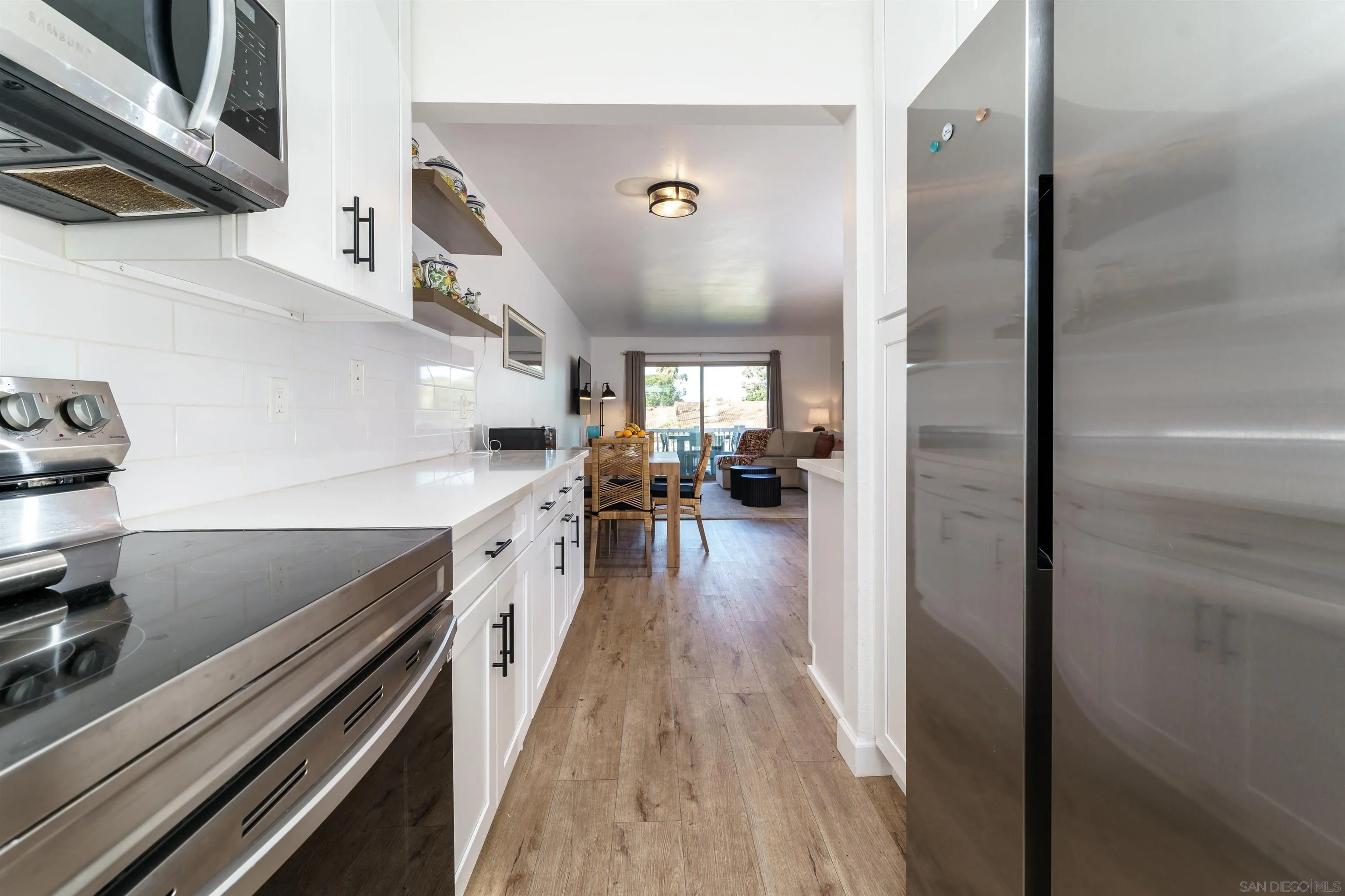346 Abington Road Encinitas, CA 92024 - Photo 21 of 33 a view of a kitchen cabinets and wooden floor