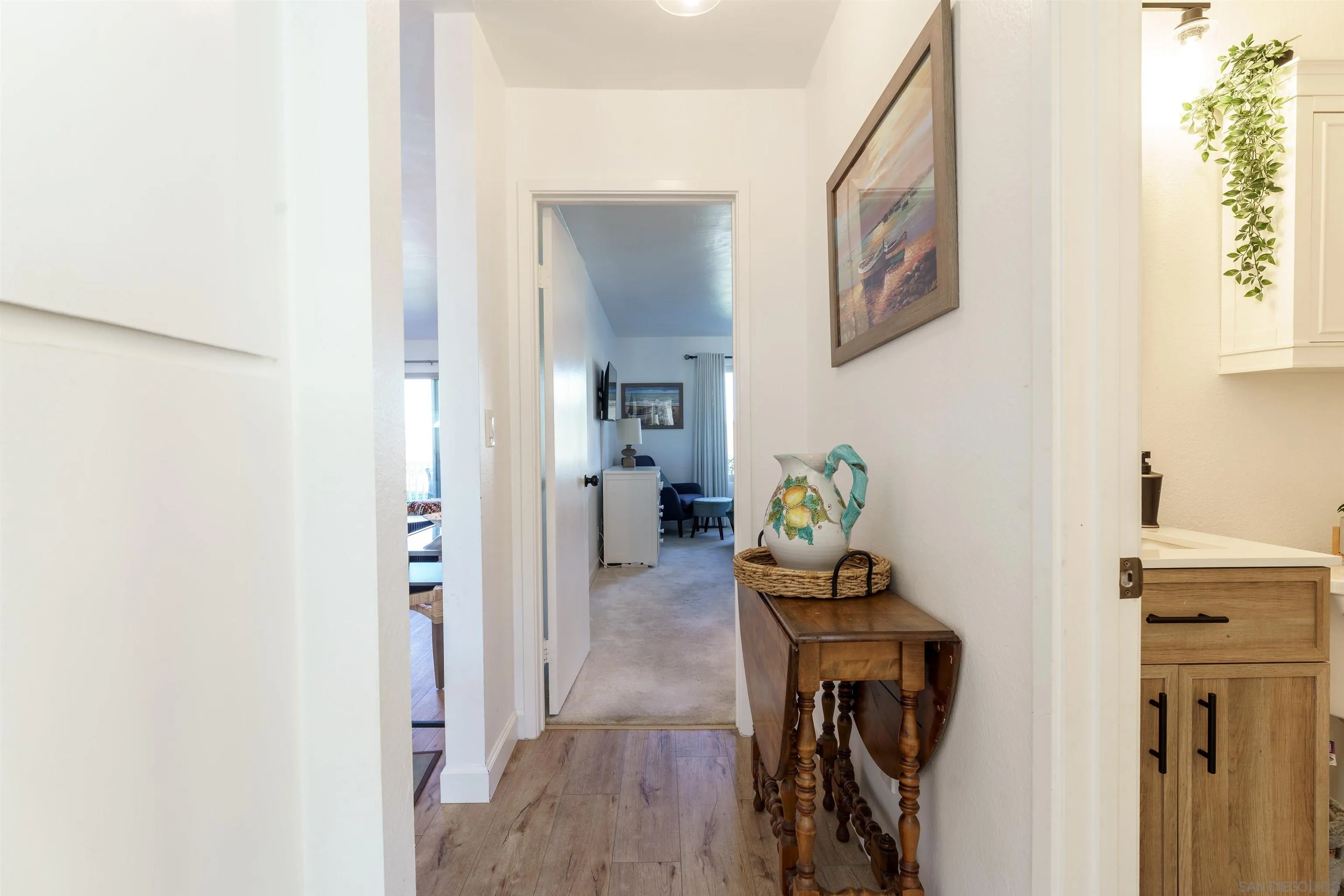 346 Abington Road Encinitas, CA 92024 - Photo 32 of 33 a view of a hallway with wooden floor and a bathroom