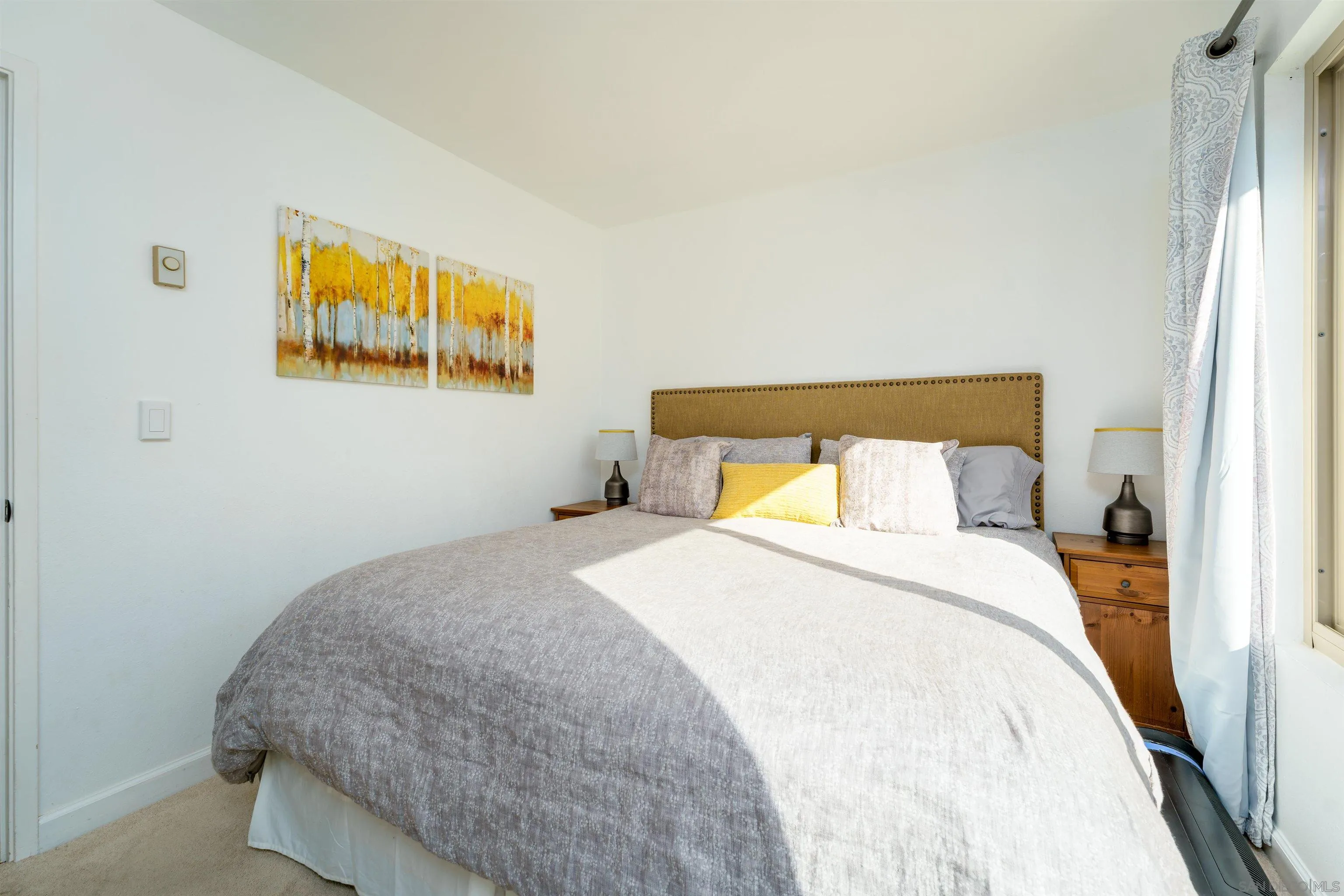 346 Abington Road Encinitas, CA 92024 - Photo 10 of 33 a bedroom with a bed and painting on the wall