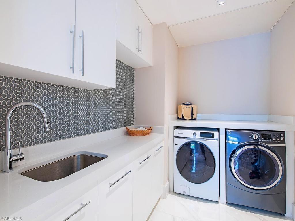 490 5th Street South, Unit 101 Naples, FL 34102 - Photo 19 of 34 a utility room with sink dryer and washer