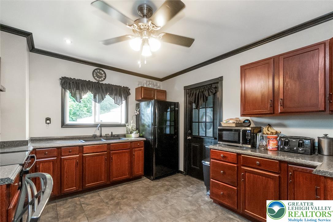 365 Rock Street Easton, PA 18042 - Photo 14 of 50 A well-appointed culinary space featuring ample wood cabinetry and durable countertops for everyday living.
