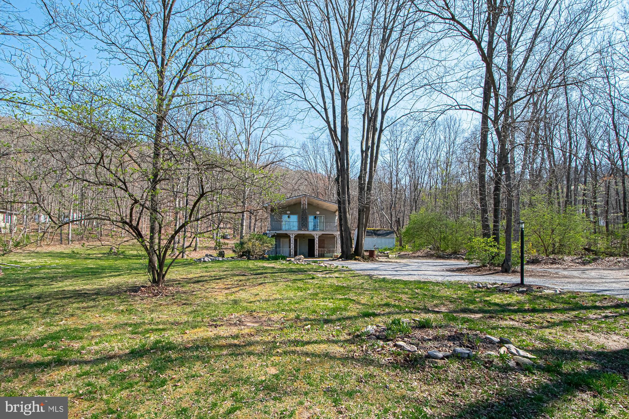 4792 Howellsville Road Front Royal, VA 22630 - Photo 12 of 41 a big house with trees in front of it