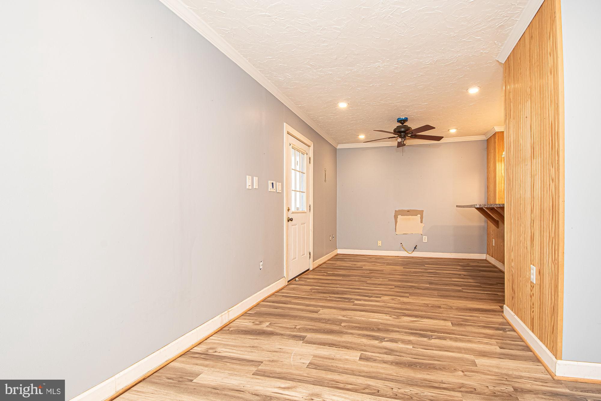 4792 Howellsville Road Front Royal, VA 22630 - Photo 18 of 41 a view of a bedroom with a bed and a chandelier