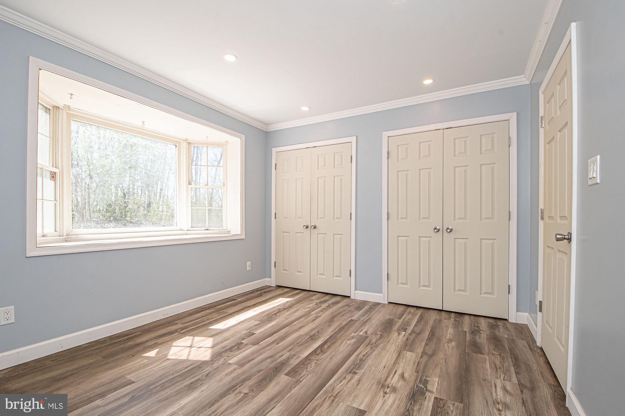 4792 Howellsville Road Front Royal, VA 22630 - Photo 25 of 41 a view of empty room with wooden floor and fan