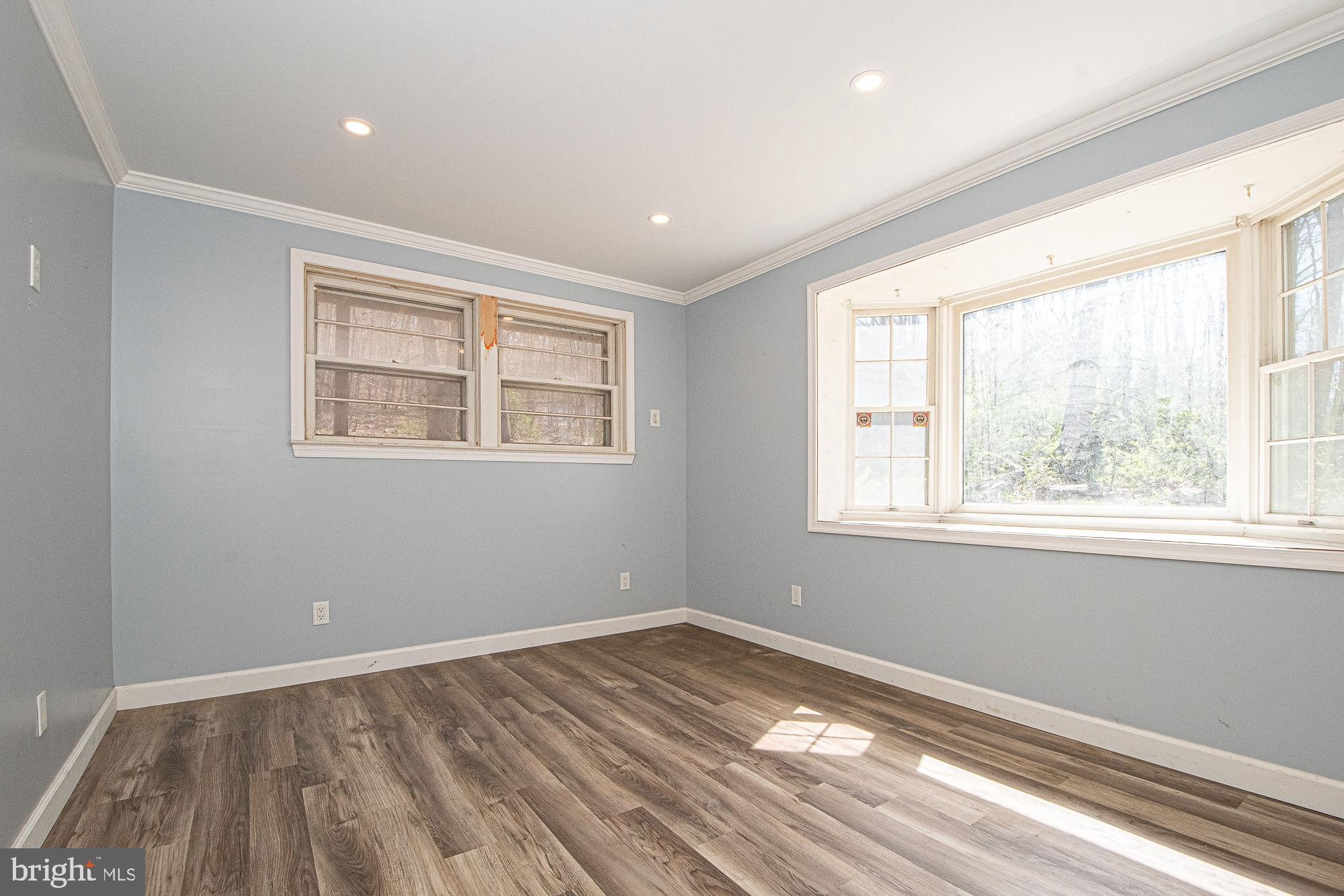 4792 Howellsville Road Front Royal, VA 22630 - Photo 26 of 41 a view of empty room with wooden floor and fan