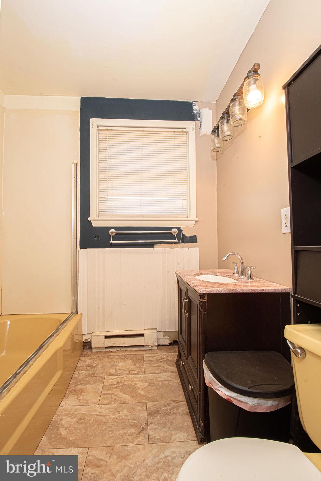 4792 Howellsville Road Front Royal, VA 22630 - Photo 28 of 41 a bathroom with a toilet a sink and a mirror