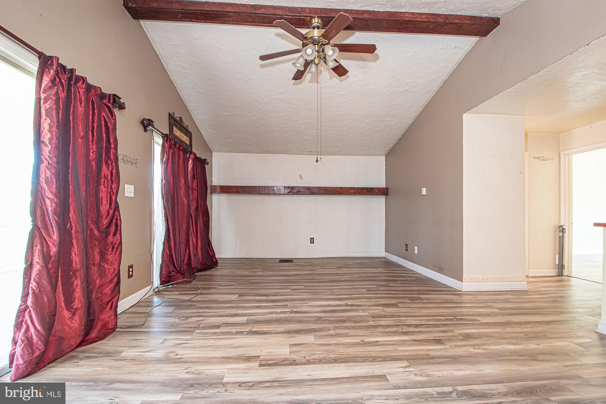 4792 Howellsville Road Front Royal, VA 22630 - Photo 31 of 41 a view of a room with a chandelier and wooden floor