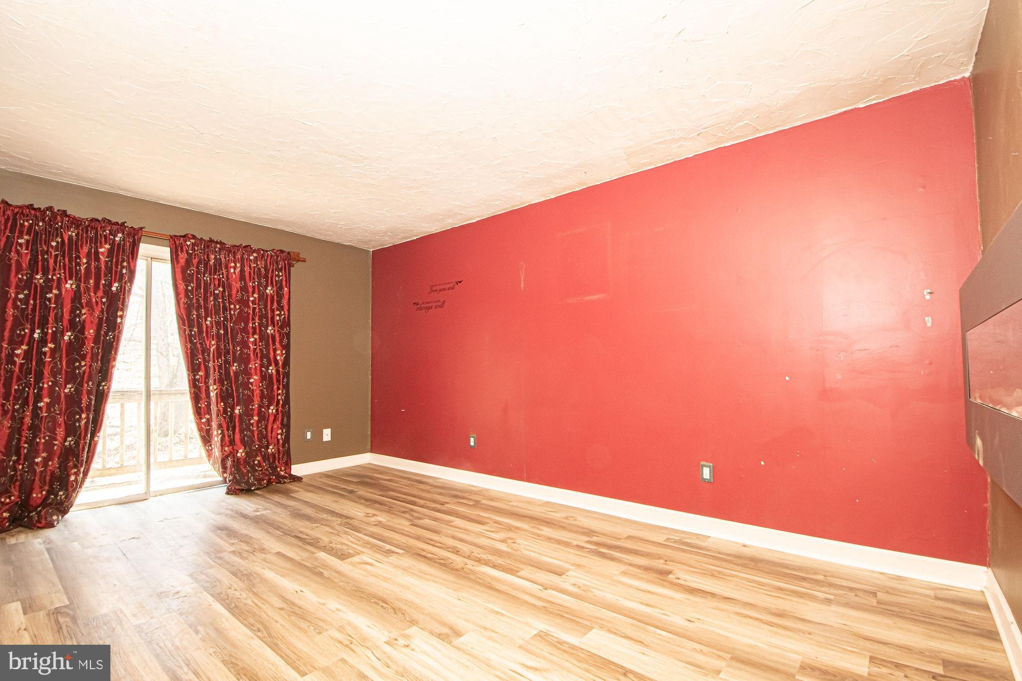 4792 Howellsville Road Front Royal, VA 22630 - Photo 33 of 41 a view of empty room with wooden floor and fan