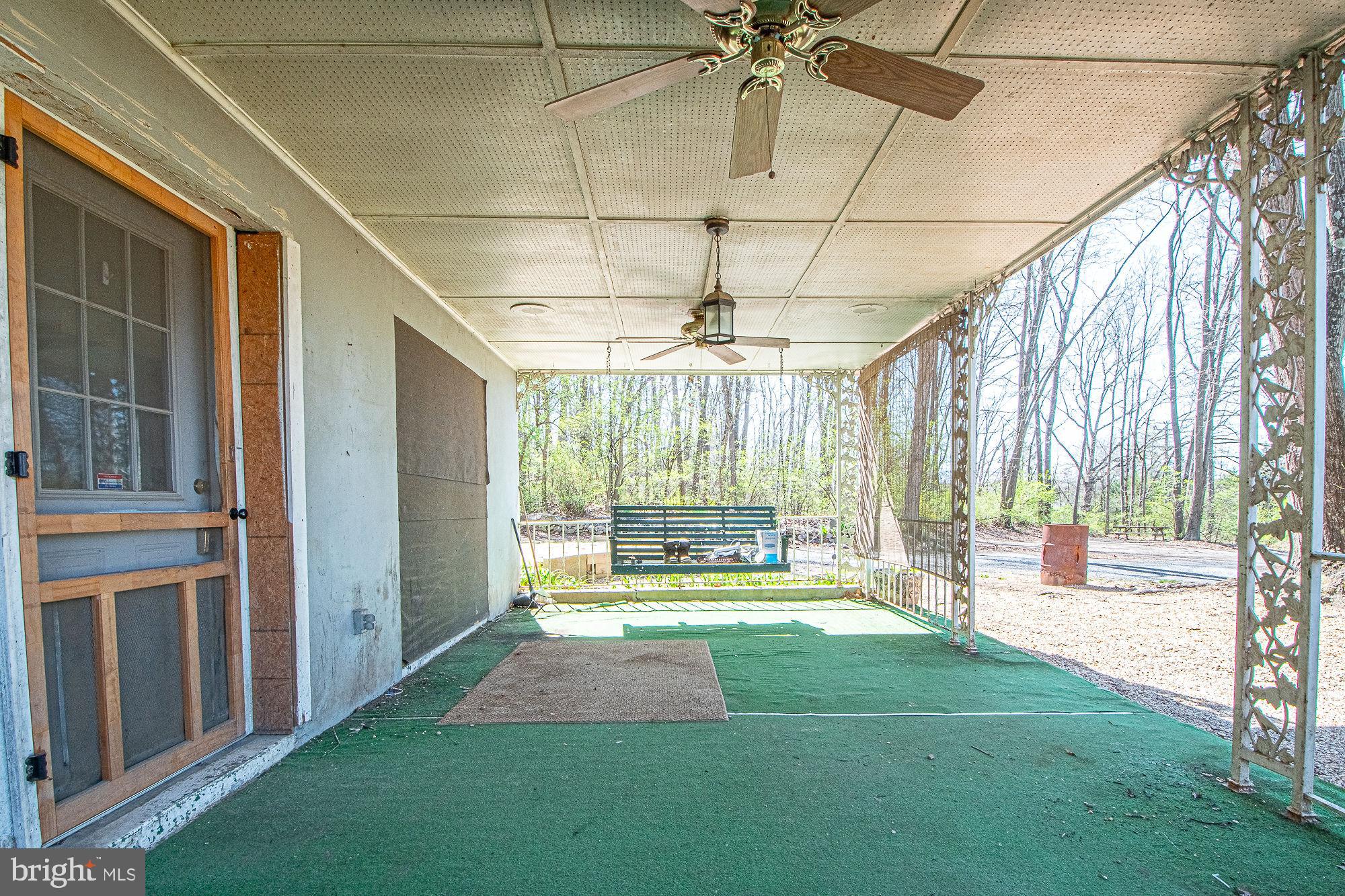4792 Howellsville Road Front Royal, VA 22630 - Photo 6 of 41 a living room with a floor to ceiling window and pool