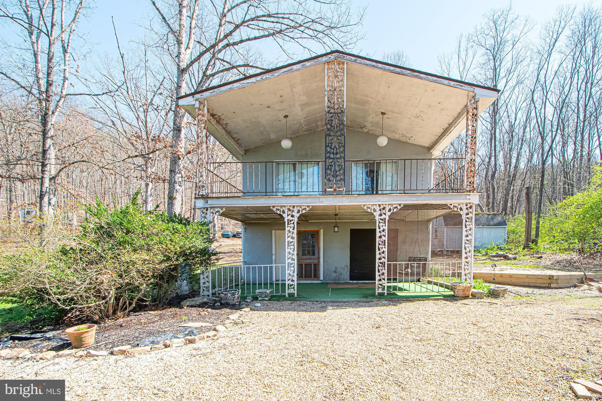 4792 Howellsville Road Front Royal, VA 22630 - Photo 10 of 41 a front view of a building with a garden