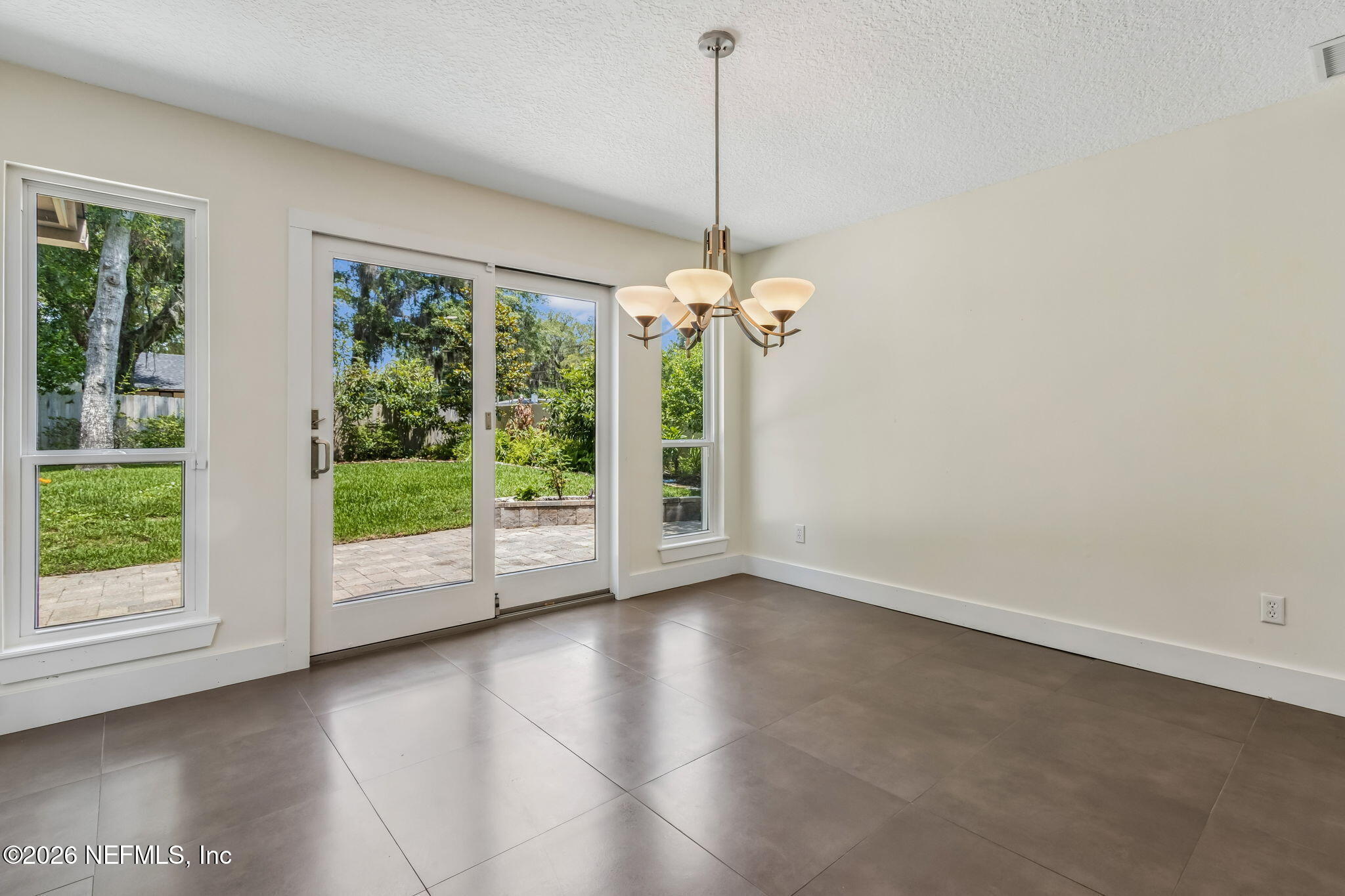 1877 Christopher Point Road South Jacksonville, FL 32217 - Photo 6 of 27 a view of empty room with wooden floor and fan