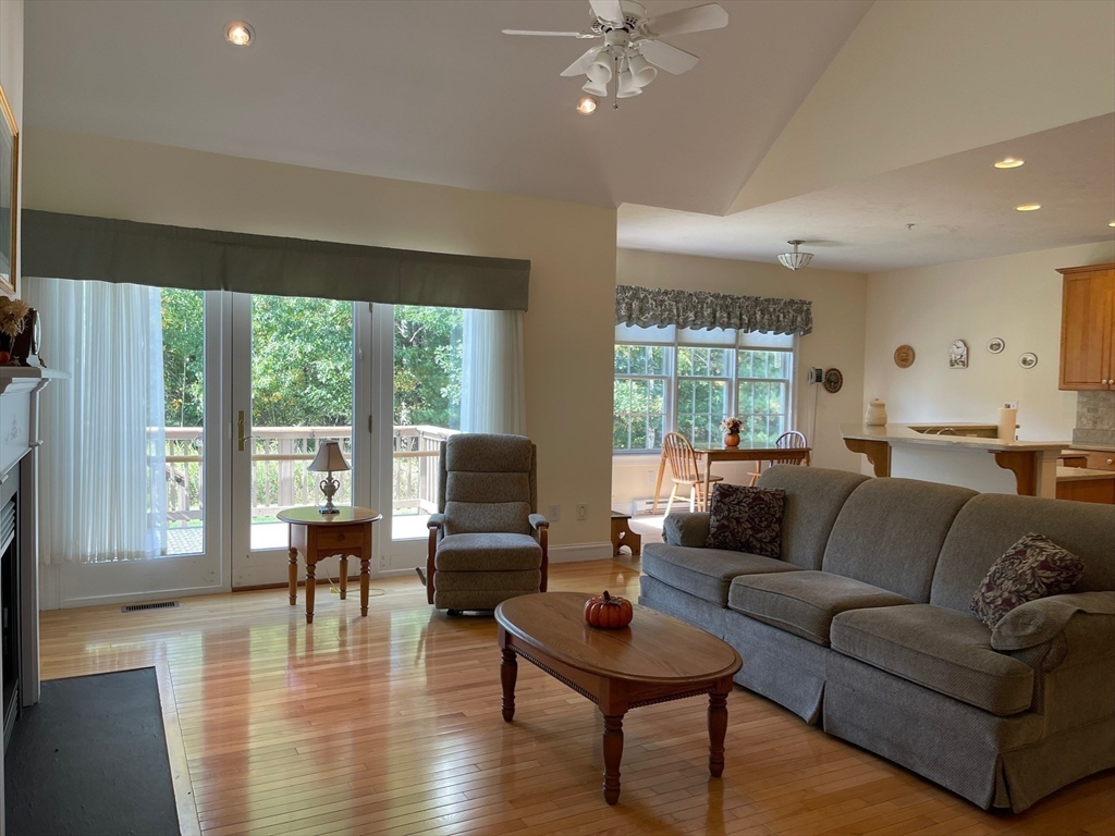 7 Sandstone Road Westford, MA 01886 - Photo 14 of 29 a living room with furniture and a large window