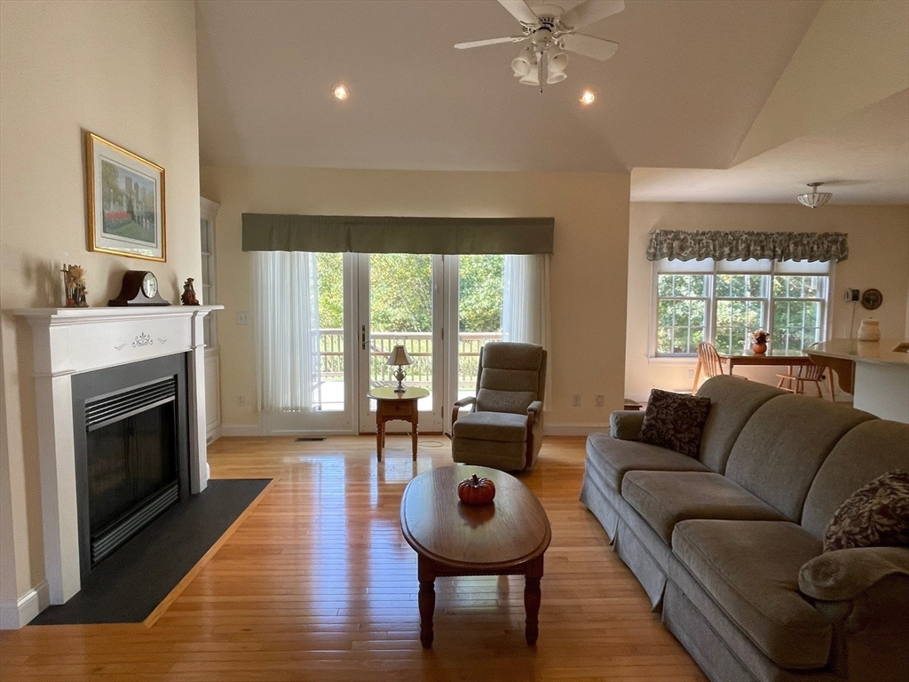 7 Sandstone Road Westford, MA 01886 - Photo 15 of 29 a living room with furniture and a fireplace