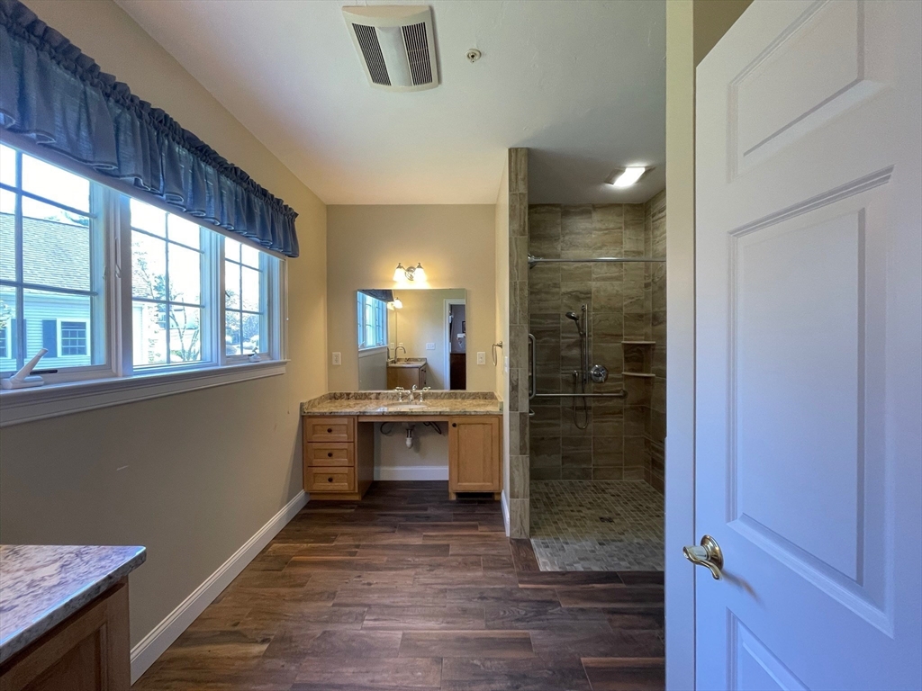 7 Sandstone Road Westford, MA 01886 - Photo 20 of 29 a bathroom with a sink and a mirror