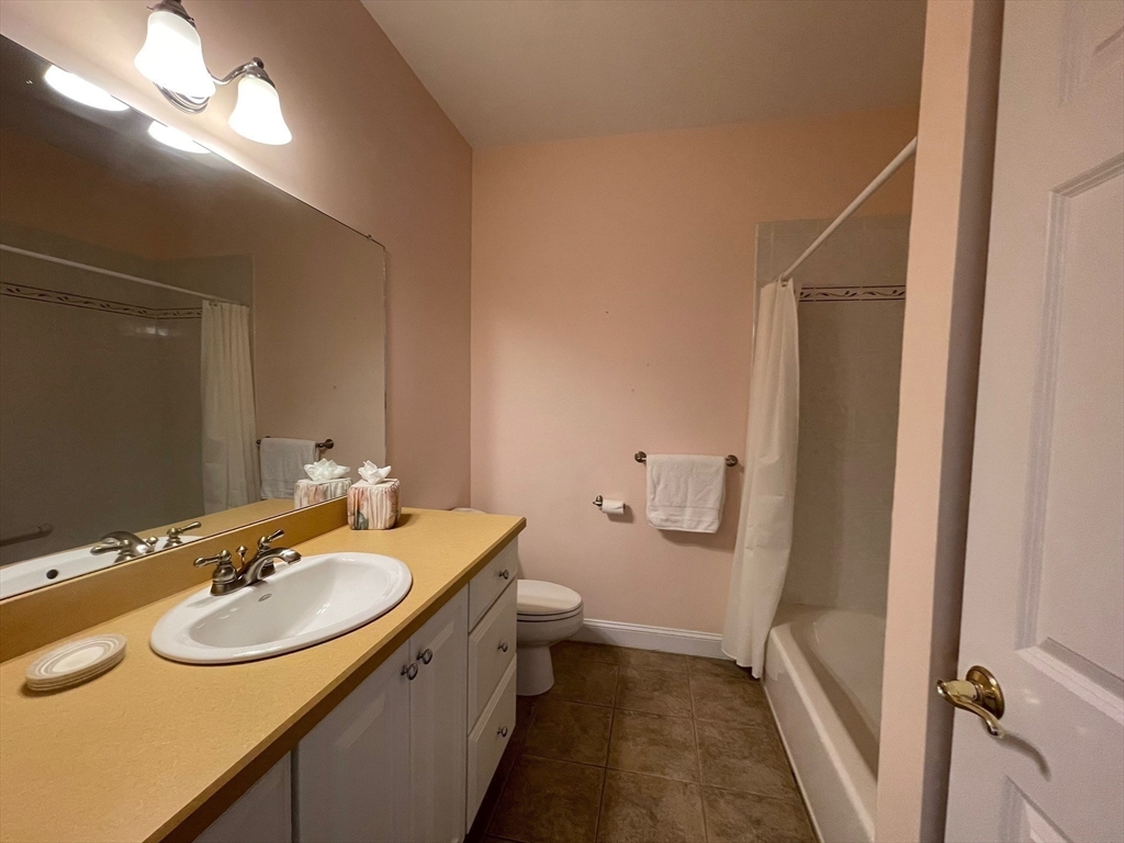 7 Sandstone Road Westford, MA 01886 - Photo 24 of 29 a bathroom with a sink toilet and a mirror