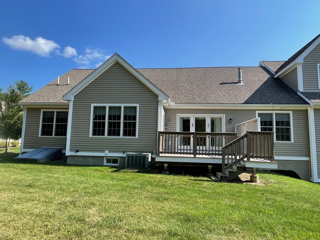 7 Sandstone Road Westford, MA 01886 - Photo 3 of 29 a front view of a house with a yard