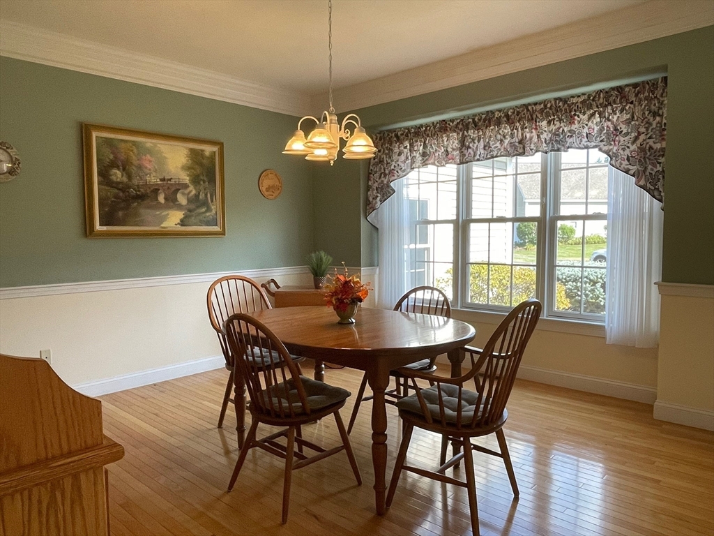7 Sandstone Road Westford, MA 01886 - Photo 5 of 29 a view of a dining room with furniture window and wooden floor